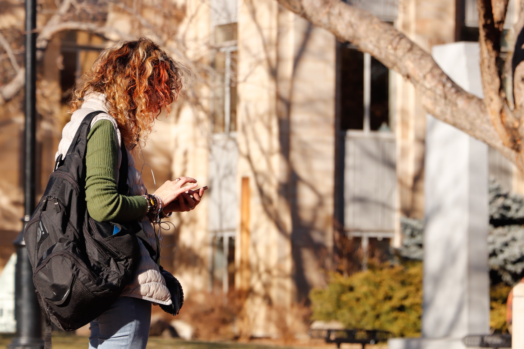 Student on campus using mobile phone