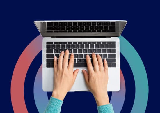 hands on laptop keyboard