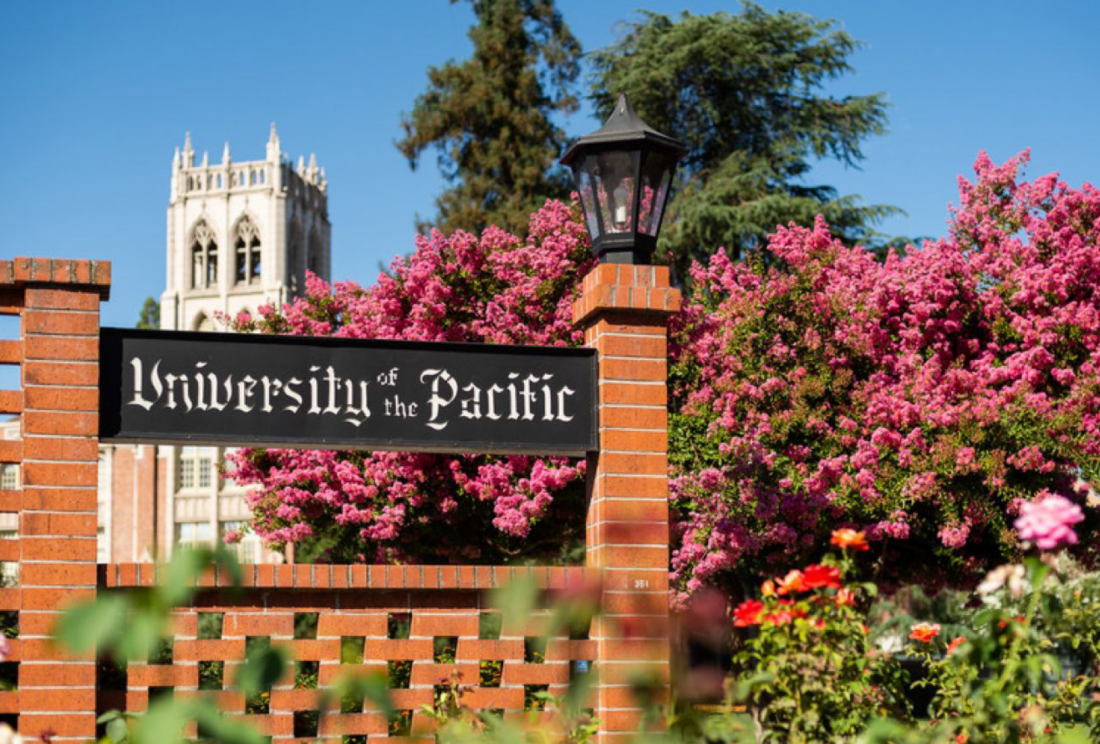 University of the Pacific brick entrance with flowering crape myrtles