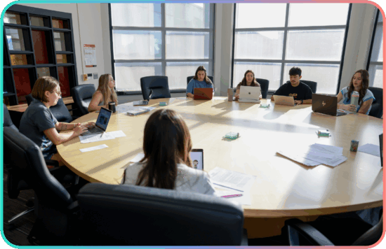 Grand View University students meeting around a conference table