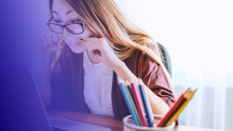 Student thinking over notes at a desk, tinted in Pathify purple — post: A Student Letter on Grad School