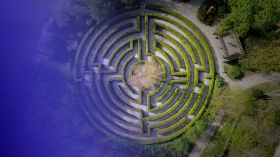 Circular garden labyrinth from above, tinted in Pathify purple — article: The Digital Ultimatum