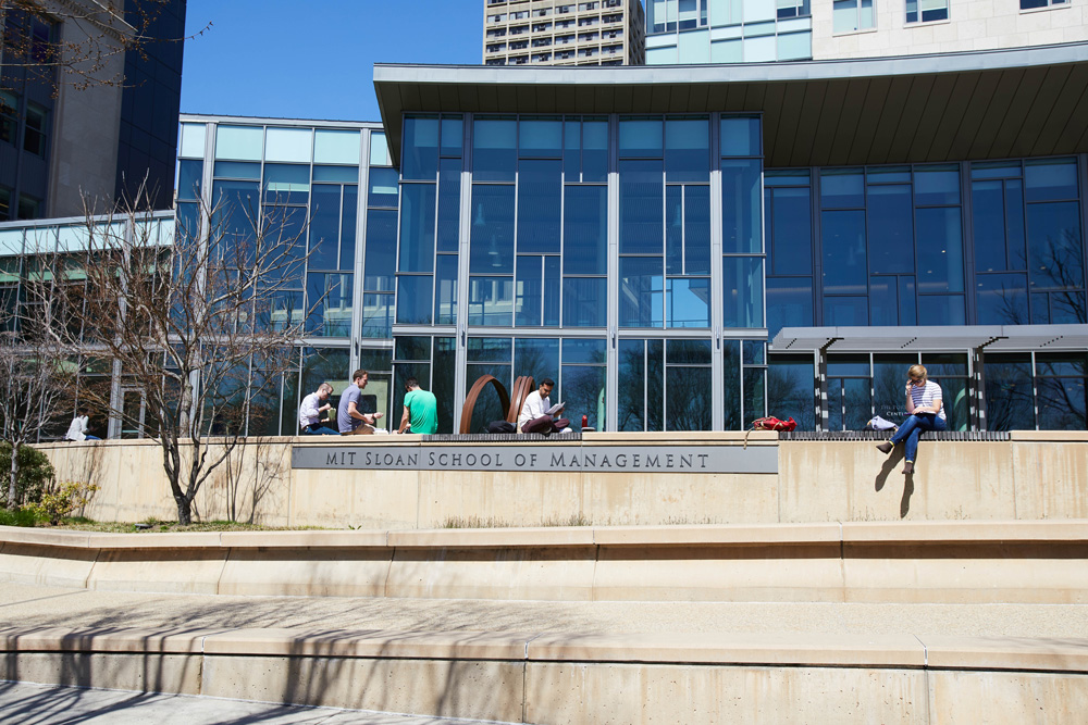 MIT Sloan campus with students sitting